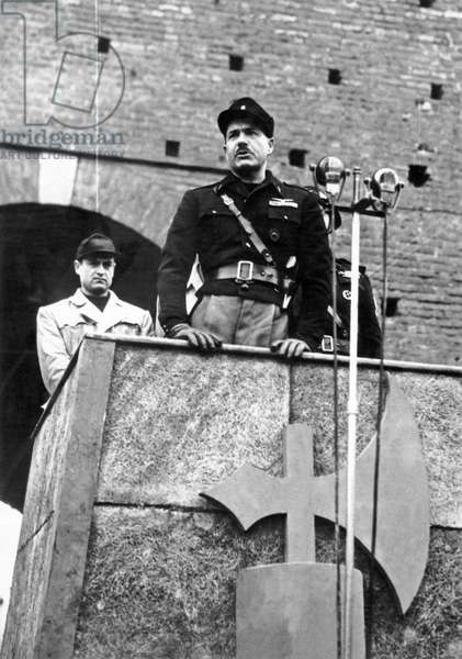 alessandro pavolini speaking at aldo resega brigade battalions oath taking, castello sforzesco, milan, february 18, 1945, italy, world war ii, 20th century