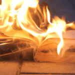 an open book is on fire