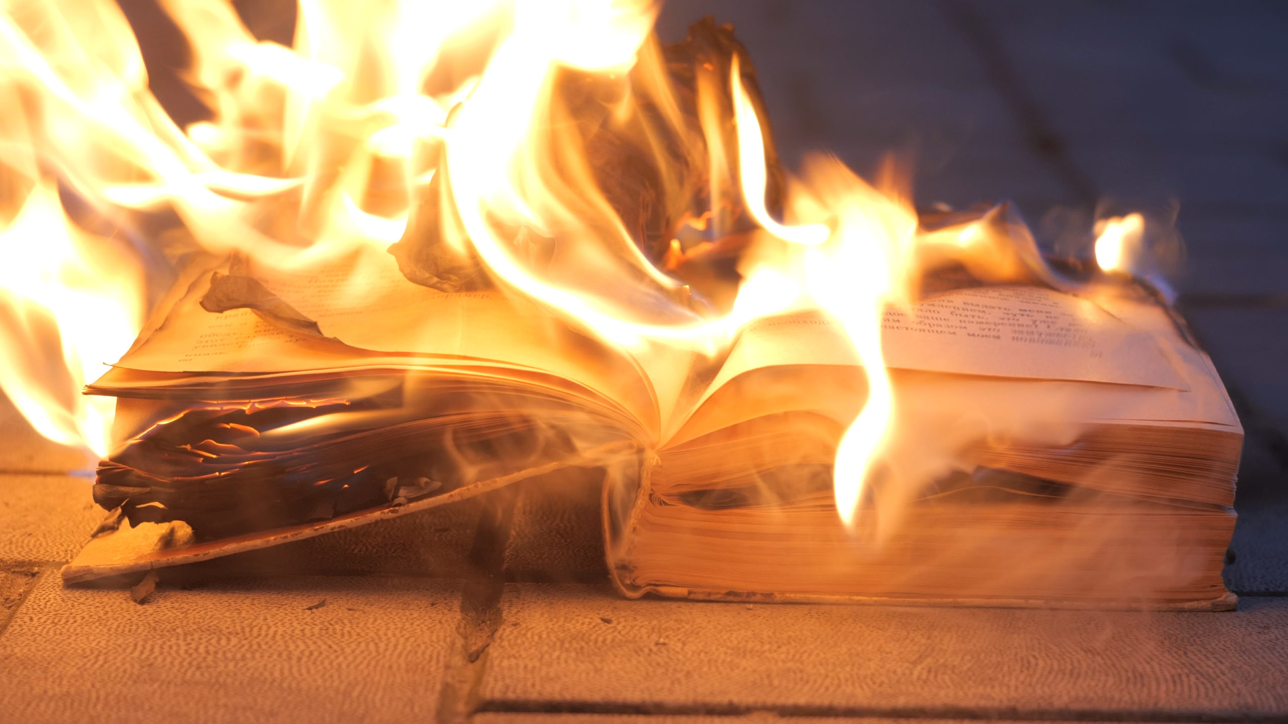 an open book is on fire